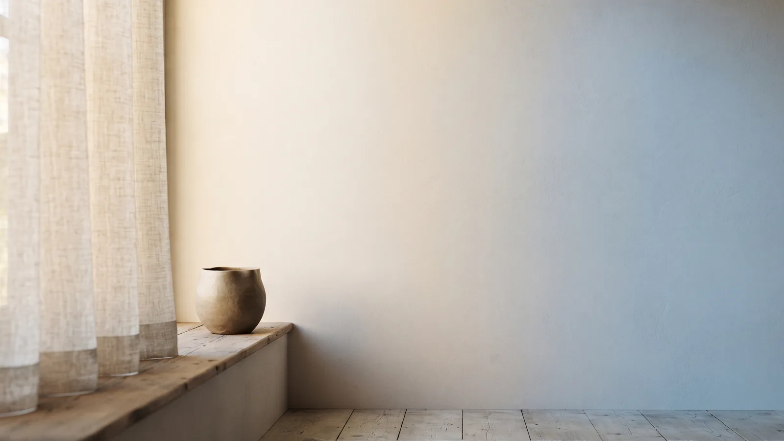 Soft bands of coloured light passing through frosted glass onto a neutral wall